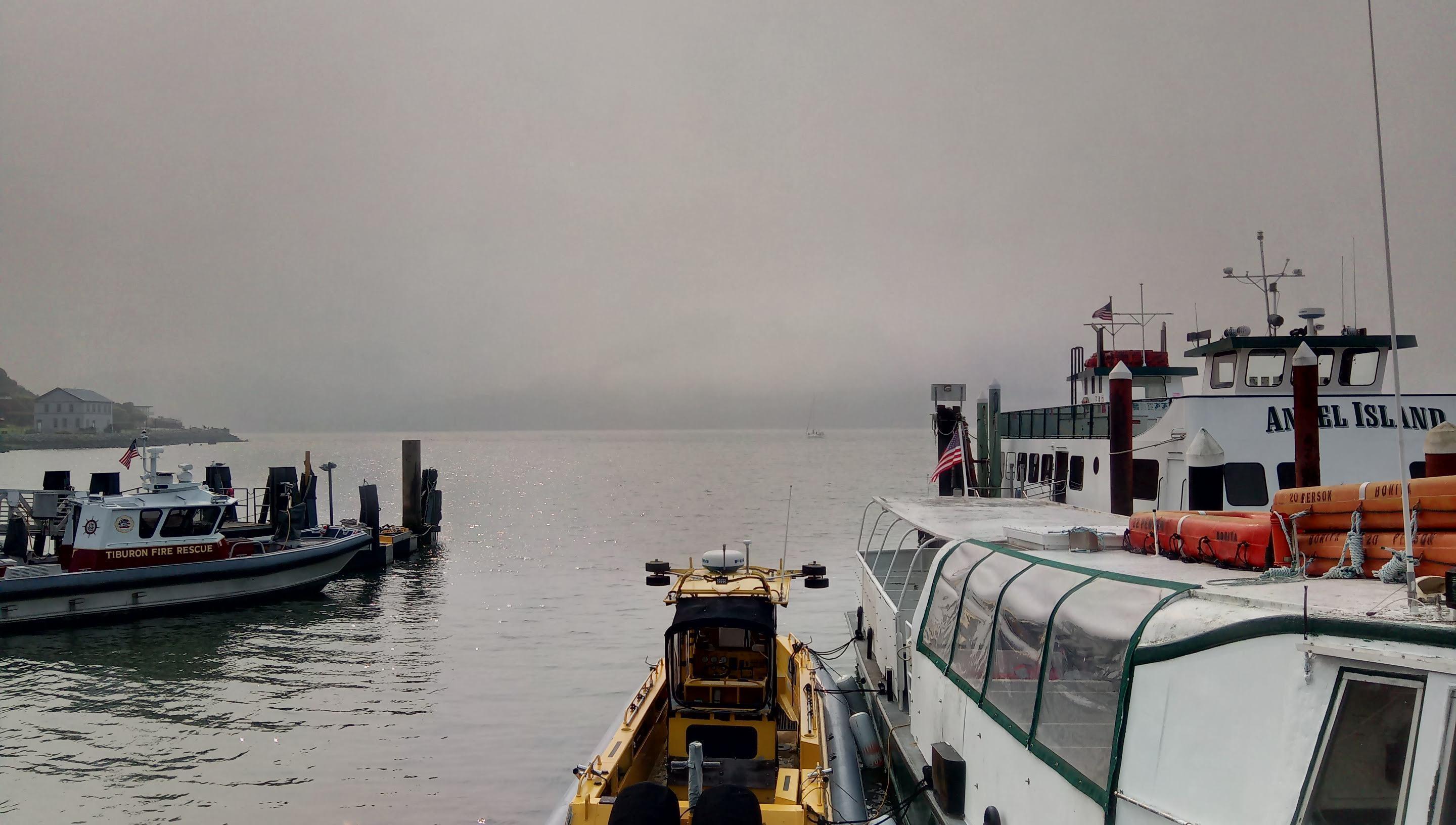 Angel Island pier. Smog and fog are hiding Angel Island