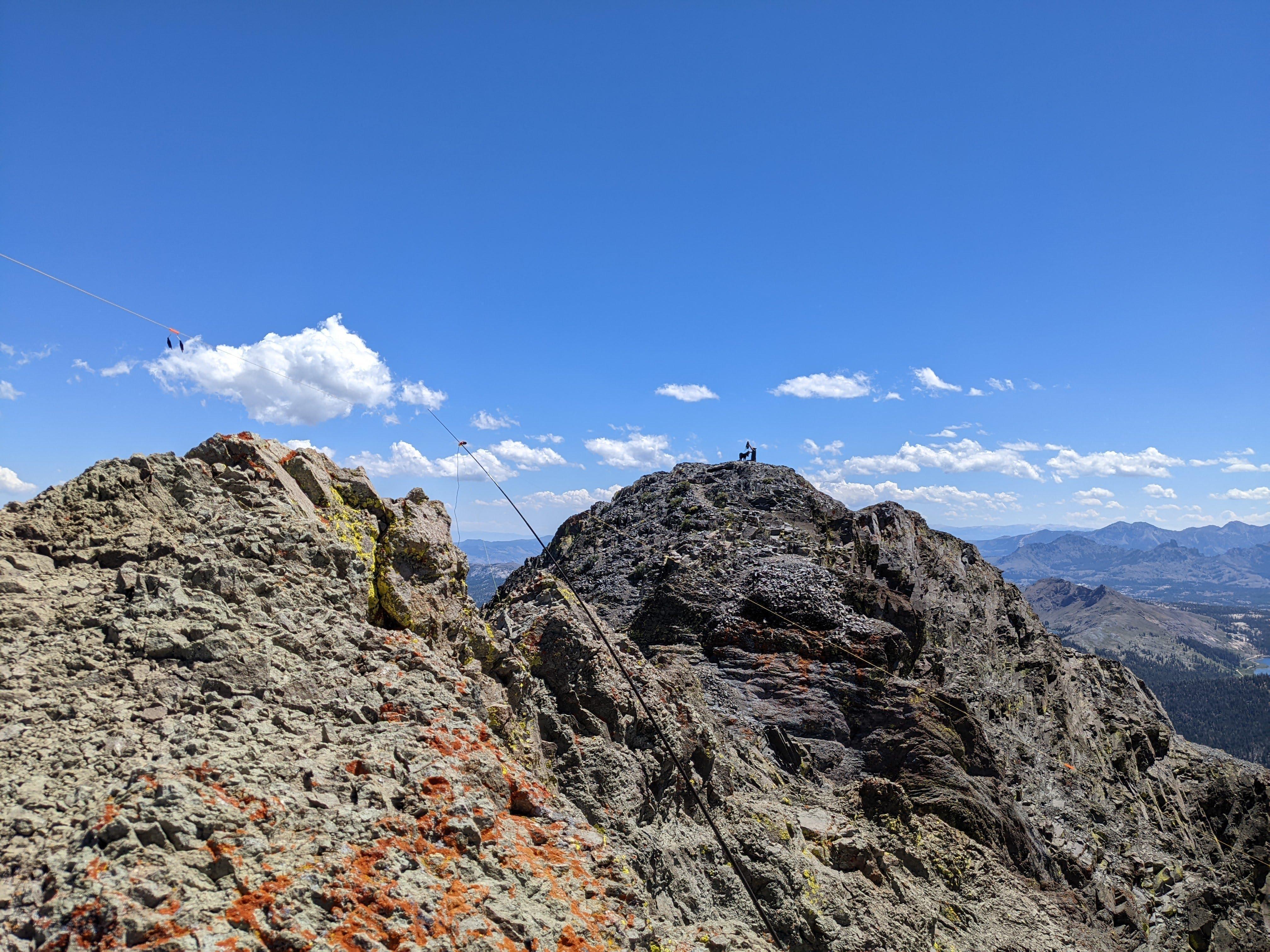 The top is quite round indeed - a dog and his man on the summit